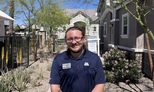 a team member posing outdoors
