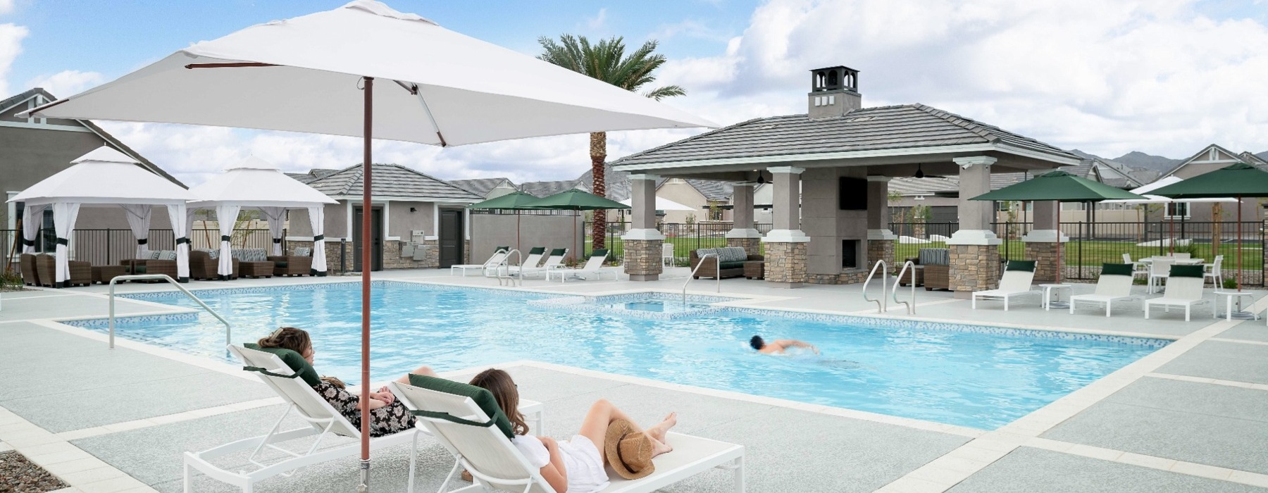 pool showing reclining seating and nearness to property buildings